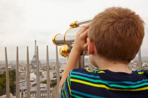 Boy Looking through Viewer over City to Eiffel Tower from Arc de Triomphe, 스톡 사진