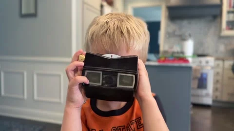 Boy Looking Through Vintage Steroscope Stock Footage 339629474
