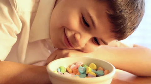 Boy Looking At Valentine's Candy Video stock 34261402