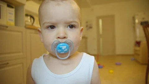 The boy looks at the camera close plan Stock Footage 114617681