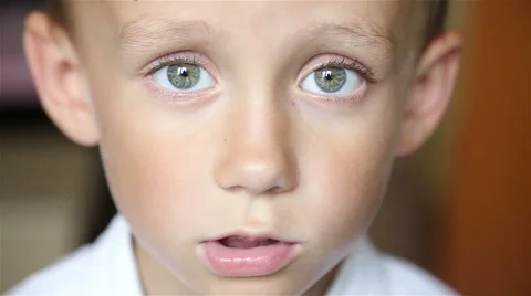 The boy looks at the camera Stock Footage 64330652