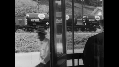 Boy looks cargo train from window - 1953 Stock Footage 95197349