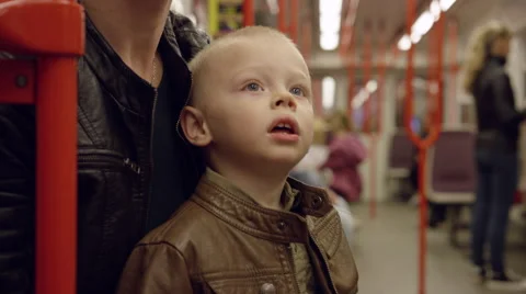 Boy Looks Inside Metro Car - 4k Stock Footage 57945688