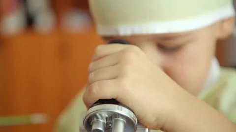 The boy looks into the microscope Stock Footage 60750248