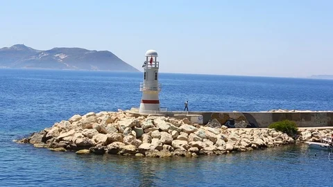 Boy Looks Out At Lighthouse Stock Footage 93399156
