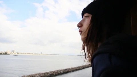 Boy looks out window of ship Stock Footage 82963594