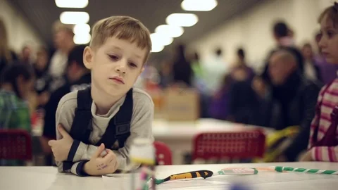 The boy looks at robots Stock Footage 71480451
