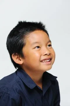 Boy looks up smiling Stock Photos
