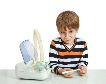 The boy looks at the thermometer. isolate on white background Stock Photos