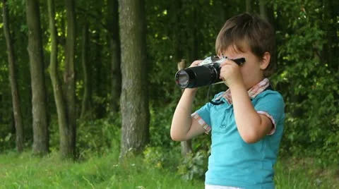 Boy Looks Through Viewfinder Stock Footage 11275672