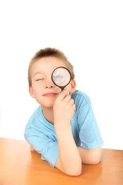 Boy with loupe Stock Photos