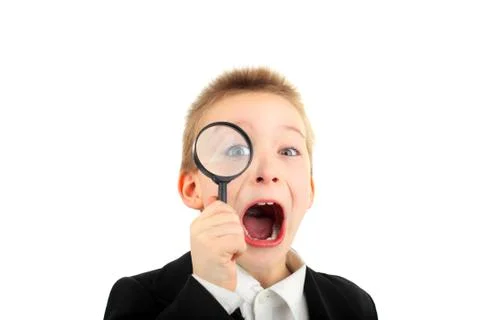 Boy with loupe Stock Photos