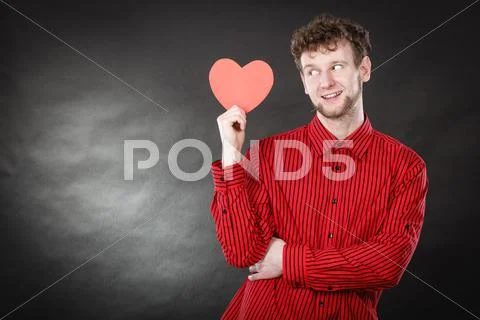 Boy in love with red heart. Stock Photos