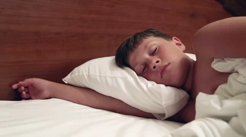 The boy is lying in bed Stock Footage 52529623