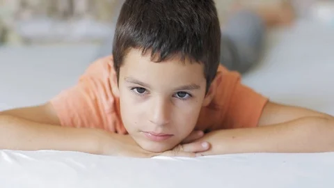Boy lying on bed Stock Footage 112187811