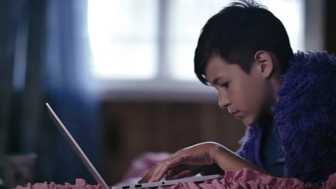 Boy Lying on Bed, Typing Text, Chatting with Friends, Coding, and Shopping Stock Footage 293257509