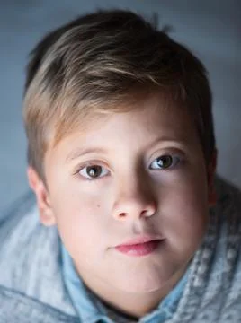 Boy lying on bright background Foto stock