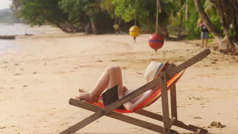 Boy Lying Down On The Sun Lounger Stock Footage 239192637
