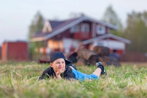 Boy lying on the grass Stock Photos