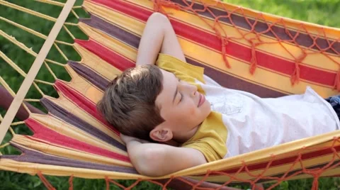 Boy Lying on a Hammock on a Nature Video stock 68311551