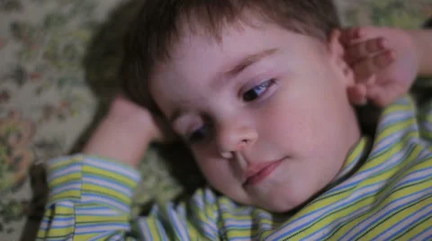 Boy lying on the sofa Stock Footage 57749533