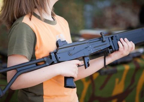 Boy with machine gun Stock Photos