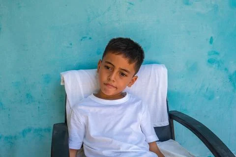 The boy made a sad face when it was time to leave his mother. Stock Photos