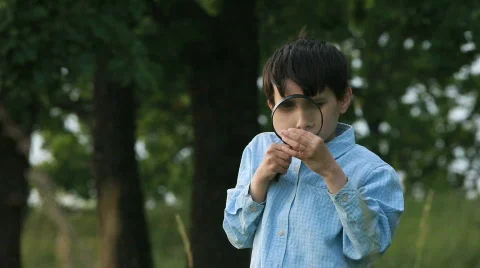 The boy with a magnifier Stock Footage 837198
