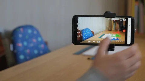 Boy make his first video blog how to draw an a car with drawing compass. Stock Footage 129012438