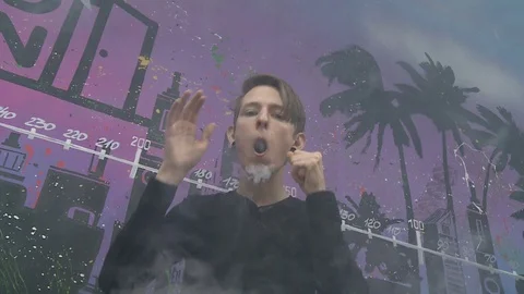 Boy make vape tricks Stock Footage 72034954