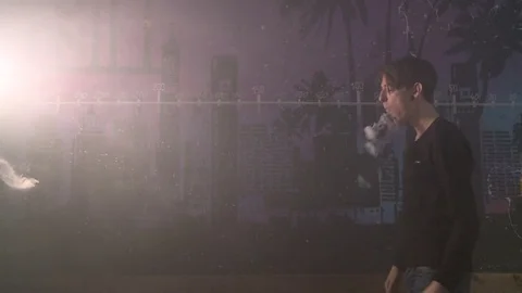 Boy make vape tricks. A lot of steam Stockbeeldmateriaal 72031334