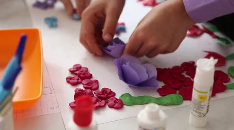 The boy makes the application of the paper Video stock 63220950