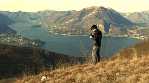 Boy makes bird watching in the mountains Stock Footage 59545587