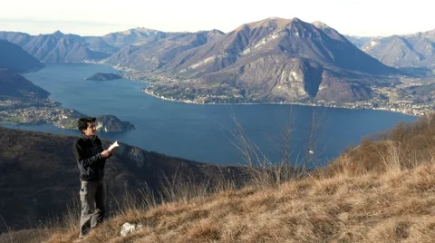 Boy makes bird watching in the mountains Stock Footage 59553979