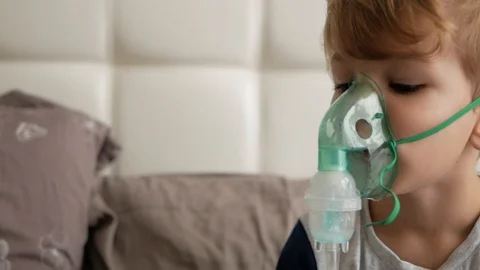 Boy makes inhalation Stock Footage 98134660