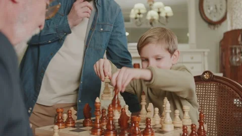 The boy makes a move in chess and puts a checkmate. A game of chess Stock Footage 235018156