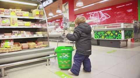 The boy makes purchases Stock Footage 166412259