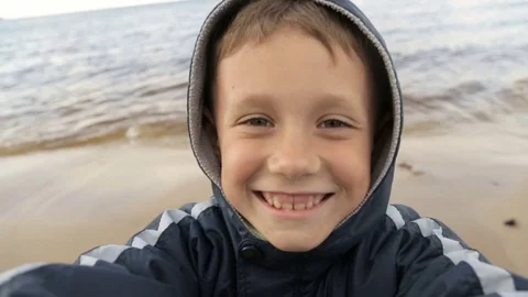 The boy makes selfie on the background of the sea Stock Footage 76940318