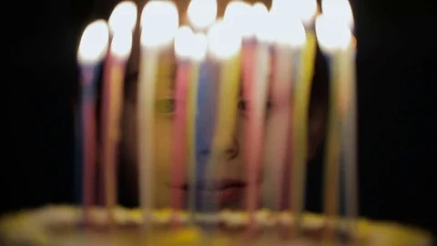 Boy makes a wish on birthday Stock Footage 76761574