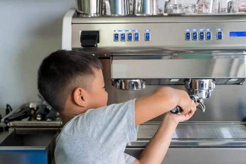 The boy making coffee with Coffee machine Stock Photos