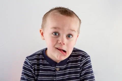 Boy making a funny face at the camera Stock Photos