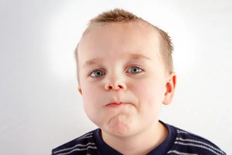 Boy making a funny face Stock Photos