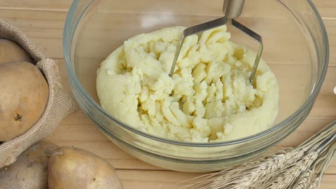 Boy making mashed potato Stock Footage 100994711