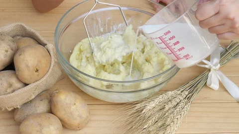 Boy making mashed potato Stock Footage 100994792