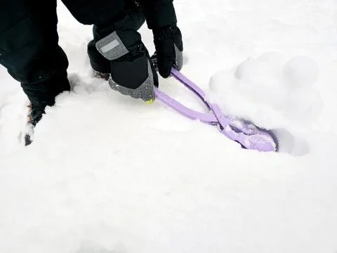 Boy is making snowballs Stock Photos