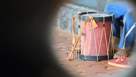 Boy making sound over a drum Stock Footage 137791720