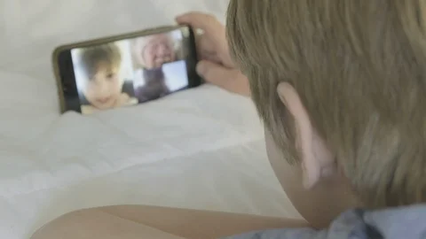 Boy making video call 스톡 동영상 127395880