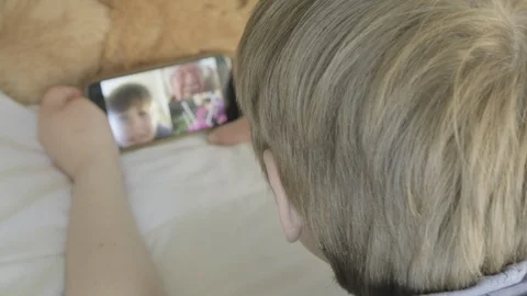Boy making video call 스톡 동영상 127398329