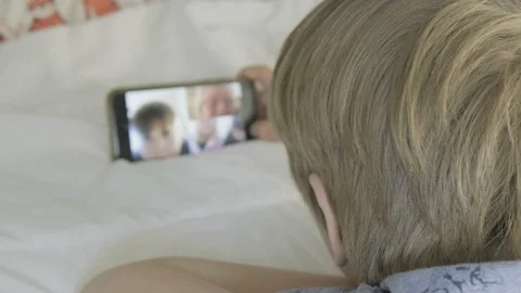 Boy making video call Video stock 127398660