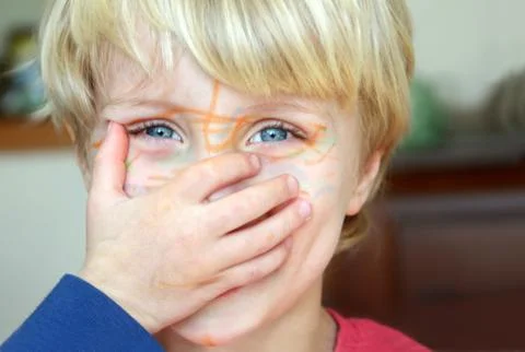 Boy with marker on face Stock Photos